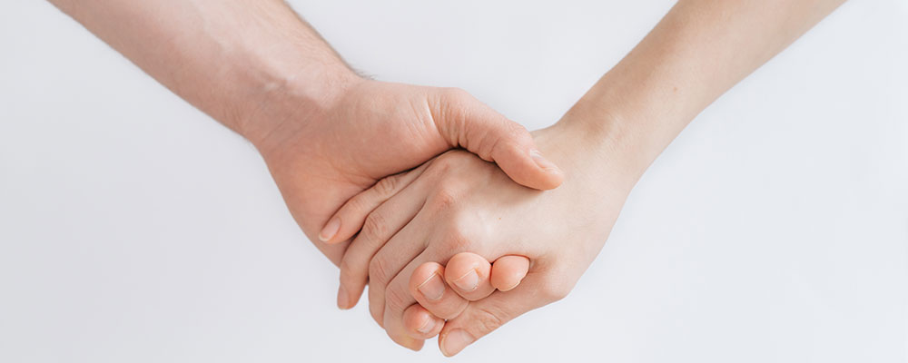 two hands held together sharing resources